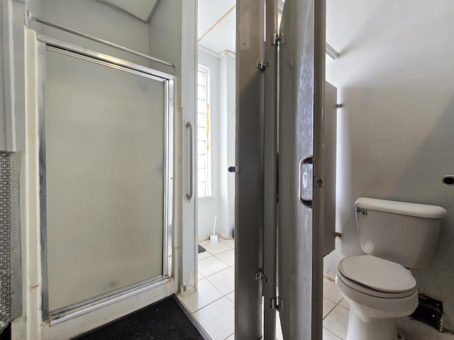 2338 W Forest Home Ave, Milwaukee, WI 53215 - full bathroom featuring tile patterned floors, toilet, and a stall shower