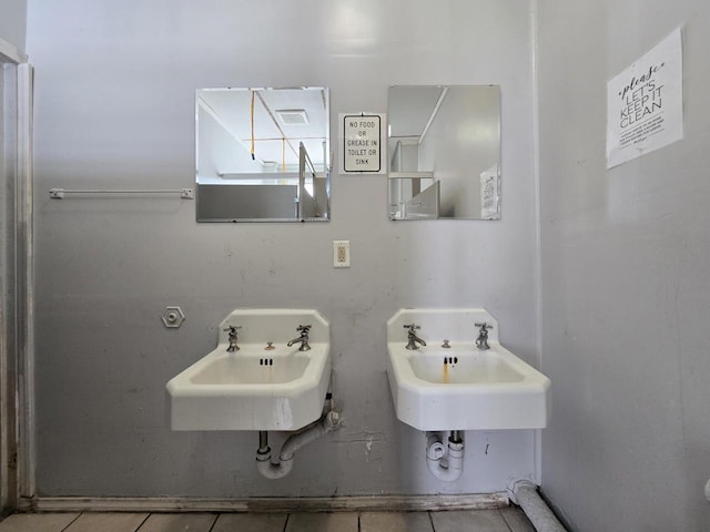 2338 W Forest Home Ave, Milwaukee, WI 53215 - bathroom featuring a sink and tile patterned floors