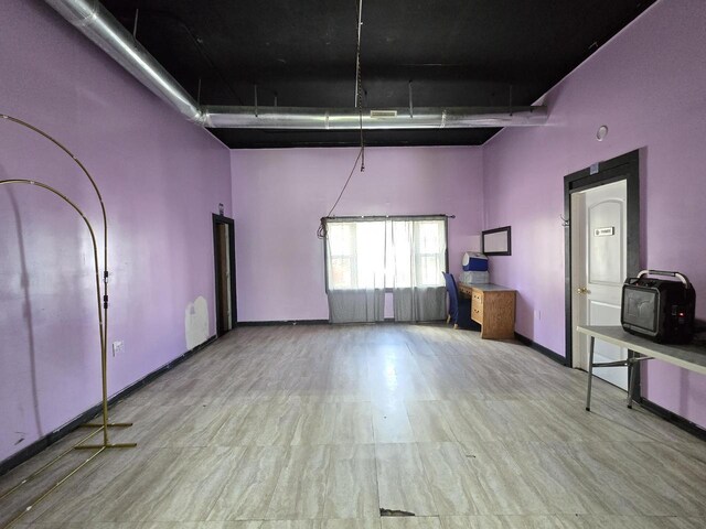 2338 W Forest Home Ave, Milwaukee, WI 53215 - below grade area with wood finished floors and baseboards