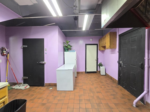 2338 W Forest Home Ave, Milwaukee, WI 53215 - below grade area featuring refrigerator and baseboards