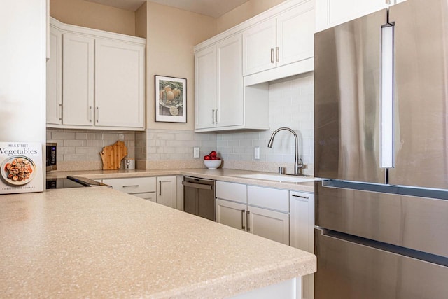 360 W Washington Ave Unit 1412, Madison, WI 53703 - kitchen with appliances with stainless steel finishes, a sink, tasteful backsplash, and white cabinets