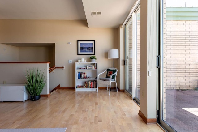 360 W Washington Ave Unit 1412, Madison, WI 53703 - sitting room featuring light wood-style flooring, healthy amount of natural light, and baseboards