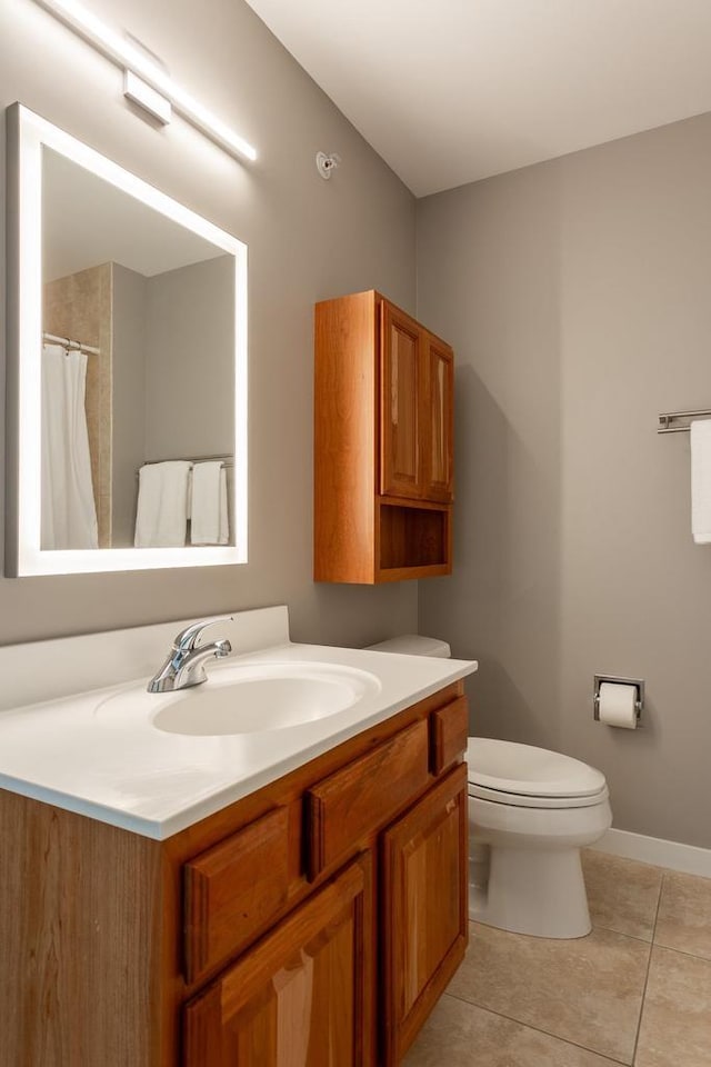 360 W Washington Ave Unit 1412, Madison, WI 53703 - full bath featuring tile patterned flooring, toilet, vanity, and baseboards