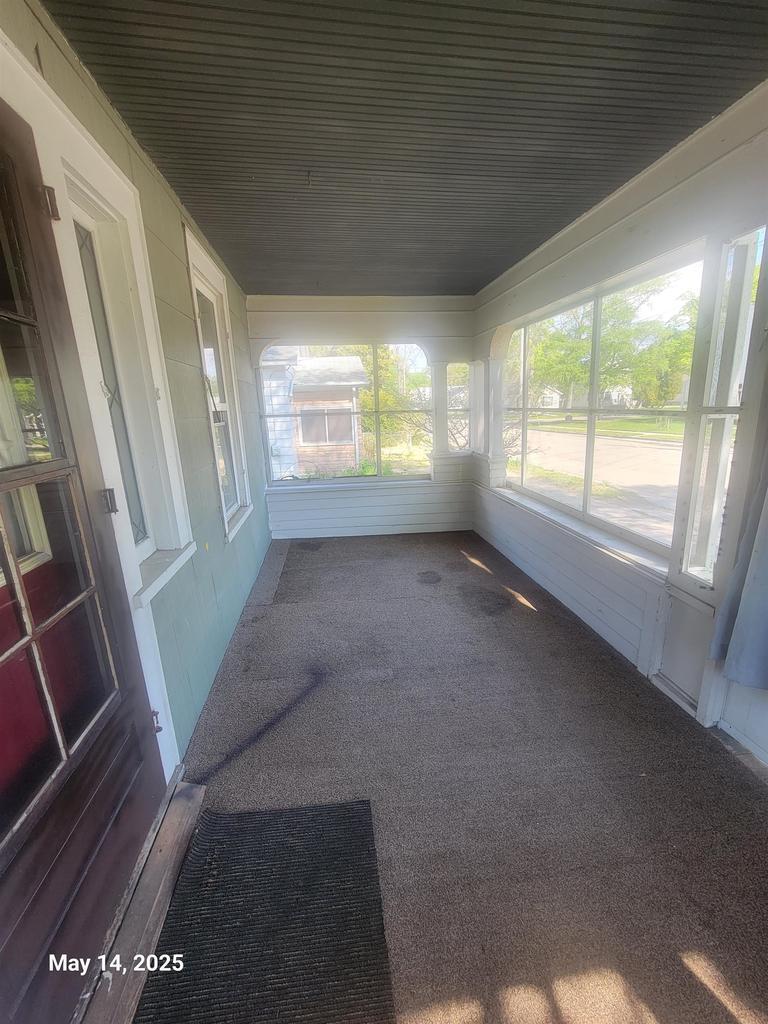 508 Hewitt St, Neenah, WI 54956 - unfurnished sunroom with carpet
