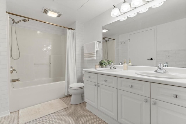 234 E Reservoir Ave Unit 104, Milwaukee, WI 53212 - bathroom with shower / tub combo, toilet, double vanity, and tile patterned floors