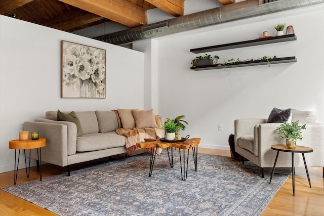234 E Reservoir Ave Unit 104, Milwaukee, WI 53212 - living room with beam ceiling, wood finished floors, and baseboards