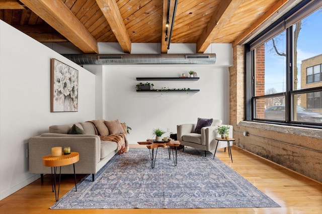234 E Reservoir Ave Unit 104, Milwaukee, WI 53212 - living area with plenty of natural light, light wood finished floors, beam ceiling, wood ceiling, and baseboards