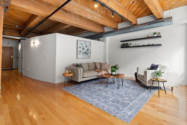 234 E Reservoir Ave Unit 104, Milwaukee, WI 53212 - living area with wooden ceiling, beam ceiling, wood finished floors, and baseboards