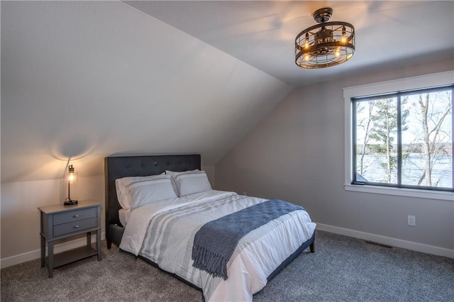 2936 W Sunset Bay, Birchwood, WI 54817 - bedroom featuring carpet floors, vaulted ceiling, and baseboards