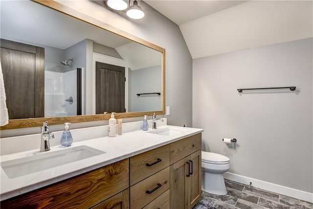2936 W Sunset Bay, Birchwood, WI 54817 - full bath featuring a shower, baseboards, toilet, double vanity, and lofted ceiling