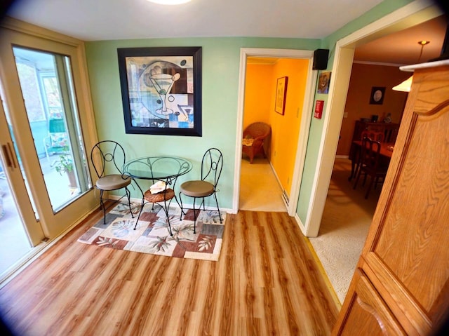 5449 Old Middleton Rd, Madison, WI 53705 - dining space featuring wood finished floors, baseboards, and healthy amount of natural light