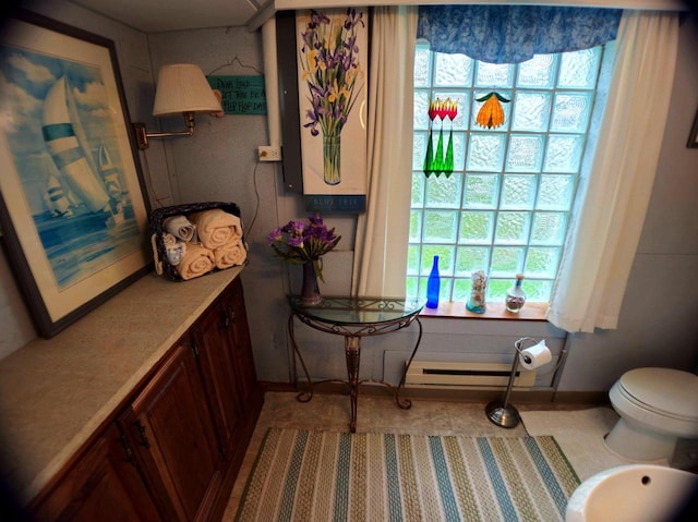 5449 Old Middleton Rd, Madison, WI 53705 - bathroom featuring baseboards, a baseboard radiator, and toilet