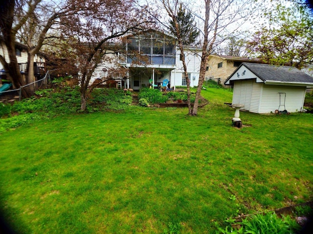 5449 Old Middleton Rd, Madison, WI 53705 - view of green lawn with an outdoor structure, a sunroom, and a shed