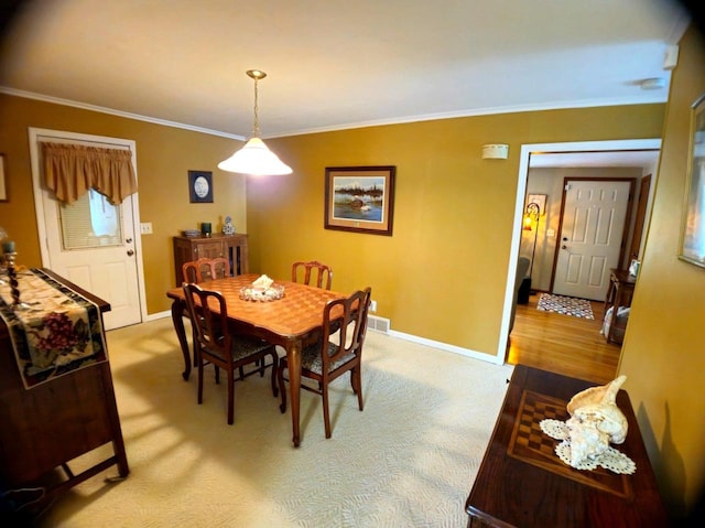 5449 Old Middleton Rd, Madison, WI 53705 - dining area with baseboards, crown molding, and light carpet
