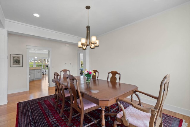 1387 Wilmington Way Unit 3-34, Lake Geneva, WI 53147 - dining room with light wood-style floors, a chandelier, baseboards, recessed lighting, and crown molding