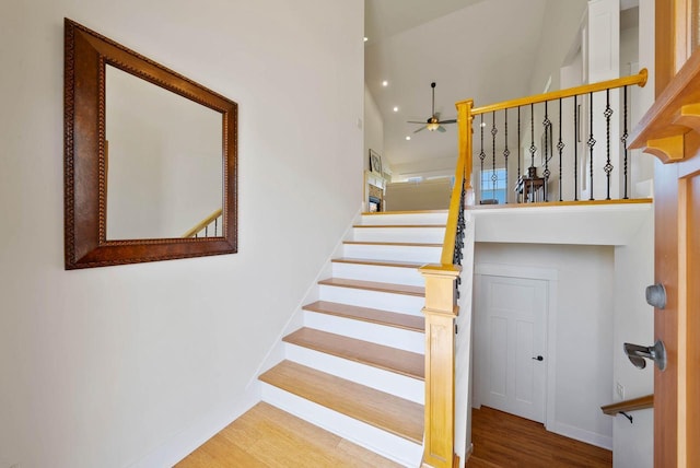 1387 Wilmington Way Unit 3-34, Lake Geneva, WI 53147 - stairs featuring a high ceiling, baseboards, a ceiling fan, wood finished floors, and recessed lighting