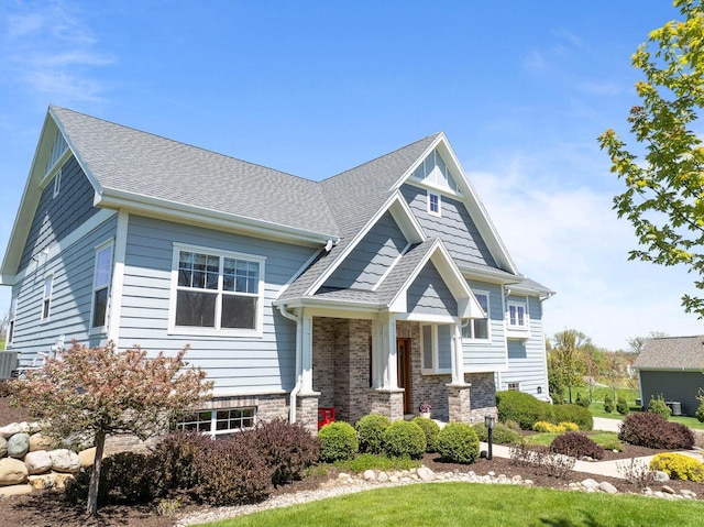 1387 Wilmington Way Unit 3-34, Lake Geneva, WI 53147 - craftsman house featuring roof with shingles, cooling unit, and brick siding