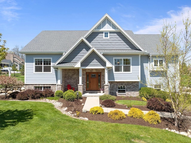 1387 Wilmington Way Unit 3-34, Lake Geneva, WI 53147 - craftsman house featuring a front yard, brick siding, and a shingled roof
