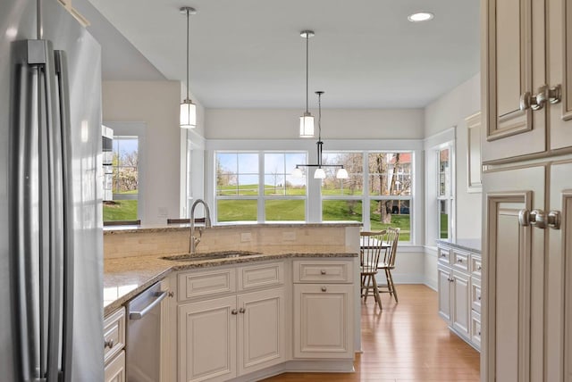 1387 Wilmington Way Unit 3-34, Lake Geneva, WI 53147 - kitchen featuring appliances with stainless steel finishes, a sink, light wood-type flooring, healthy amount of natural light, and recessed lighting