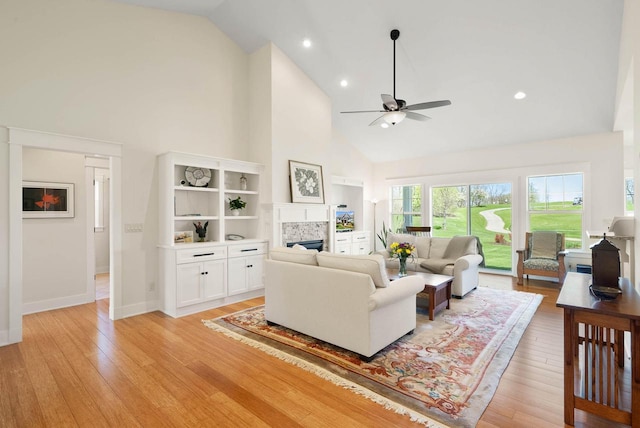1387 Wilmington Way Unit 3-34, Lake Geneva, WI 53147 - living area with high vaulted ceiling, a fireplace, ceiling fan, light wood-style floors, and baseboards