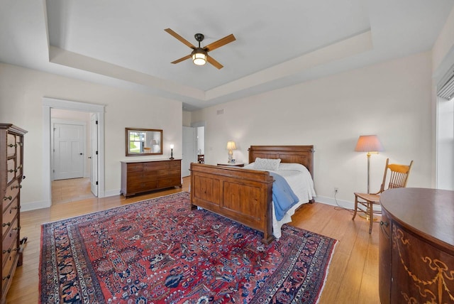 1387 Wilmington Way Unit 3-34, Lake Geneva, WI 53147 - bedroom featuring a raised ceiling, light wood-style flooring, and baseboards