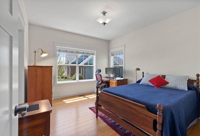 1387 Wilmington Way Unit 3-34, Lake Geneva, WI 53147 - bedroom featuring wood finished floors, an office area, and baseboards