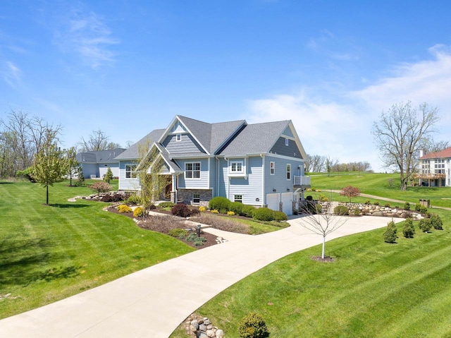 1387 Wilmington Way Unit 3-34, Lake Geneva, WI 53147 - view of front of home with a garage, driveway, a front yard, and stone siding