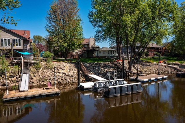 dock area with stairs and a water view