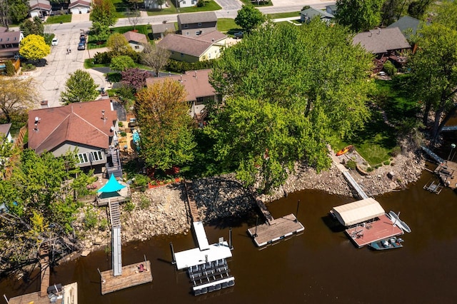 aerial view of residential area with a nearby body of water