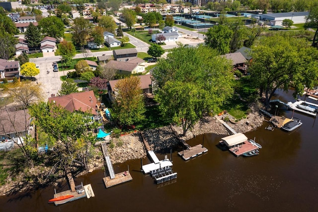 aerial view of residential area featuring a large body of water