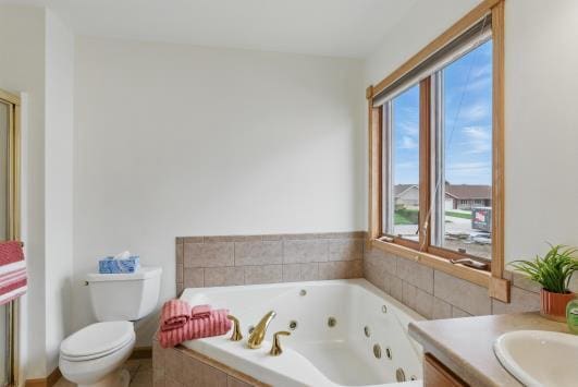 453 Jasper Ct Unit A, Kiel, WI 53042 - full bath featuring a jetted tub, toilet, and vanity