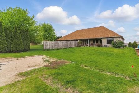 453 Jasper Ct Unit A, Kiel, WI 53042 - rear view of house featuring a yard
