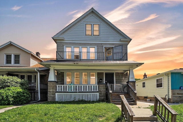 2936 S 9th Pl, Milwaukee, WI 53215 - traditional style home with a balcony, covered porch, and a lawn