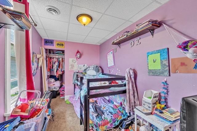 2936 S 9th Pl, Milwaukee, WI 53215 - bedroom featuring a paneled ceiling, carpet floors, a closet, and multiple windows
