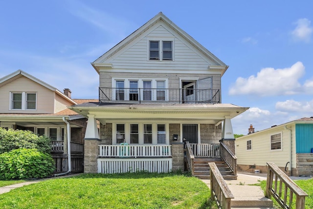 2936 S 9th Pl, Milwaukee, WI 53215 - view of front of home with a balcony, covered porch, and a front yard