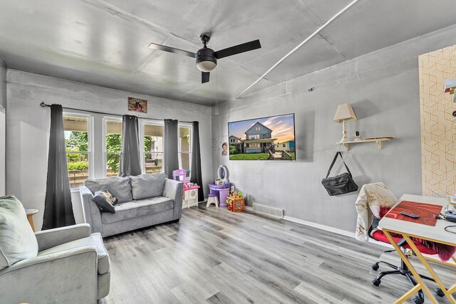 2936 S 9th Pl, Milwaukee, WI 53215 - living room with a ceiling fan, wood finished floors, and baseboards
