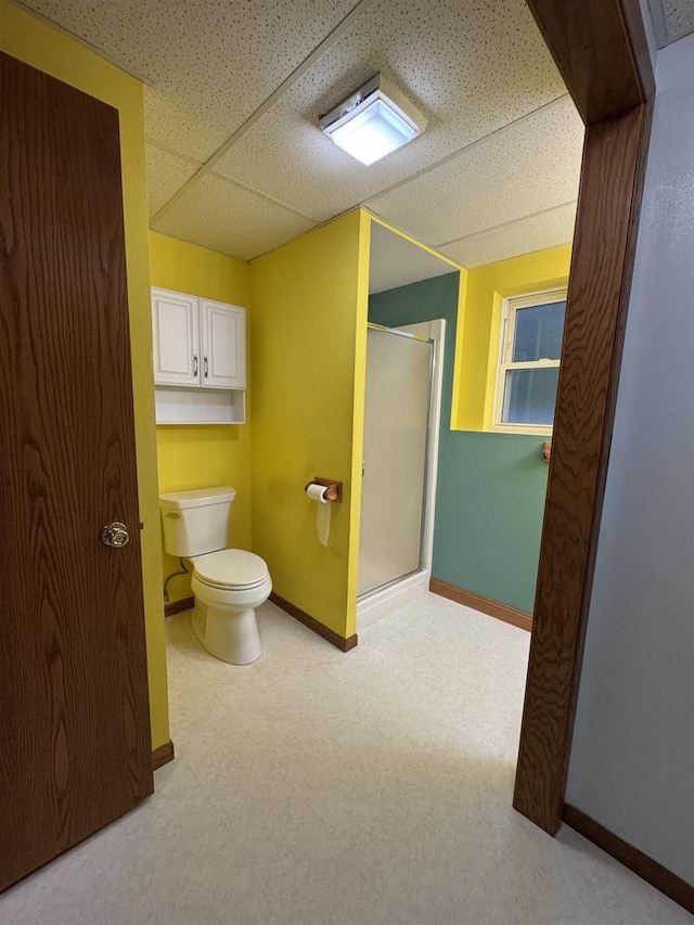 1900 Arthur St, Merrill, WI 54452 - bathroom featuring a stall shower, tile patterned floors, and a paneled ceiling