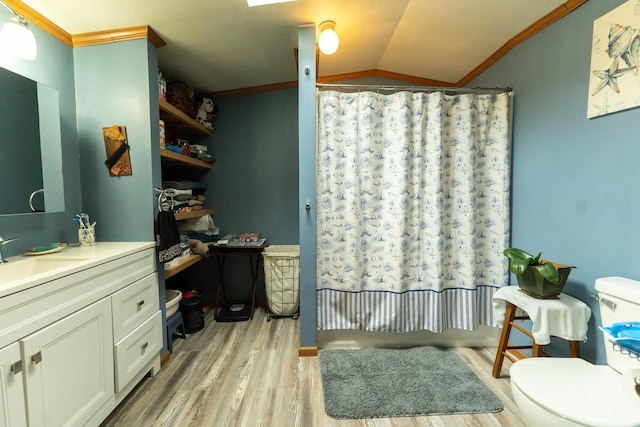 277 James St, Tomah, WI 54660 - full bathroom featuring wood finished floors, ornamental molding, lofted ceiling, curtained shower, and toilet