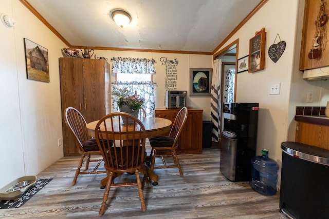 277 James St, Tomah, WI 54660 - dining area featuring crown molding and wood finished floors