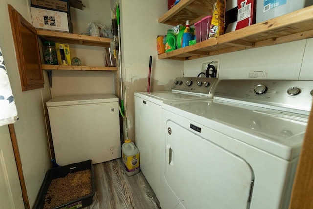 277 James St, Tomah, WI 54660 - washroom with washing machine and clothes dryer and wood finished floors