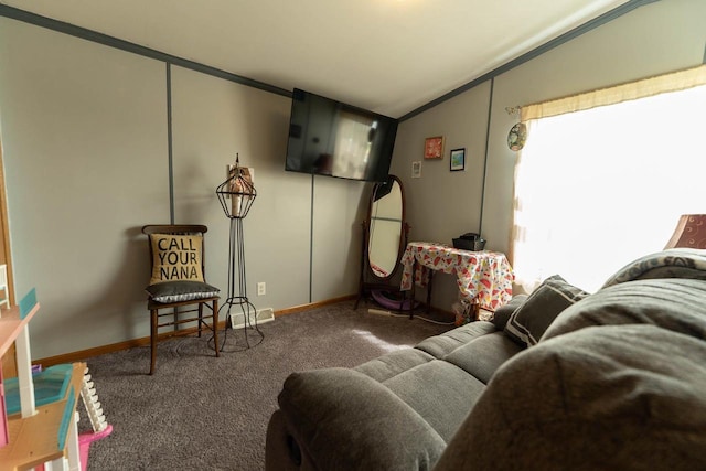 277 James St, Tomah, WI 54660 - living area with carpet flooring, baseboards, ornamental molding, and lofted ceiling