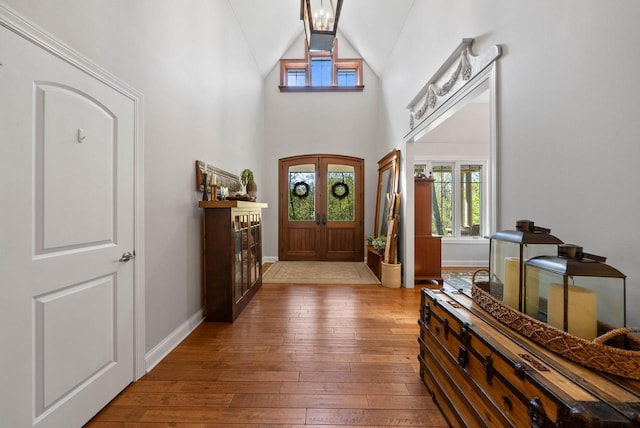 1521 Geneva Club Dr Unit 18-05, Lake Geneva, WI 53147 - entrance foyer with hardwood / wood-style flooring, baseboards, and high vaulted ceiling