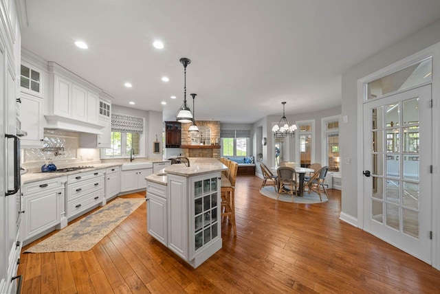 1521 Geneva Club Dr Unit 18-05, Lake Geneva, WI 53147 - kitchen with a sink, backsplash, white cabinetry, and recessed lighting