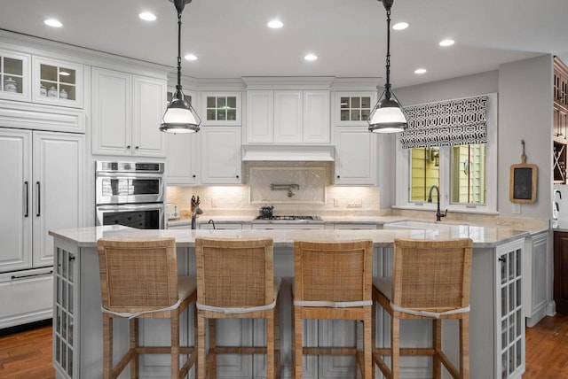 1521 Geneva Club Dr Unit 18-05, Lake Geneva, WI 53147 - kitchen with a sink, stainless steel appliances, white cabinets, tasteful backsplash, and glass insert cabinets