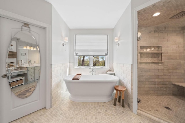 1521 Geneva Club Dr Unit 18-05, Lake Geneva, WI 53147 - full bath with a stall shower, a soaking tub, tile walls, vanity, and tile patterned floors