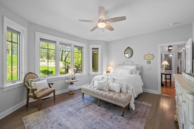 1521 Geneva Club Dr Unit 18-05, Lake Geneva, WI 53147 - bedroom with multiple windows, dark wood finished floors, and baseboards