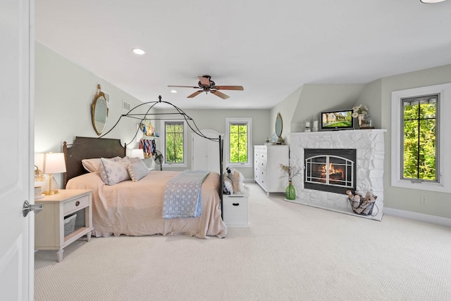 1521 Geneva Club Dr Unit 18-05, Lake Geneva, WI 53147 - carpeted bedroom featuring a stone fireplace, recessed lighting, baseboards, and a ceiling fan