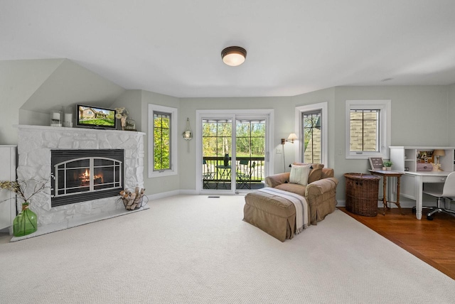 1521 Geneva Club Dr Unit 18-05, Lake Geneva, WI 53147 - living area featuring healthy amount of natural light, a fireplace, carpet flooring, and baseboards