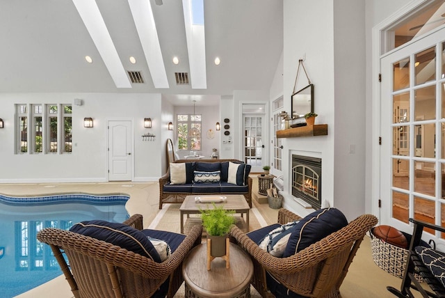 1521 Geneva Club Dr Unit 18-05, Lake Geneva, WI 53147 - living room with a glass covered fireplace, high vaulted ceiling, and beamed ceiling
