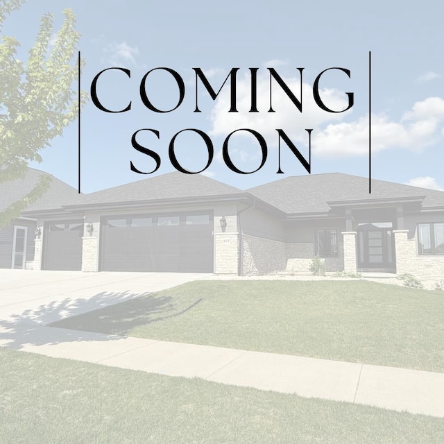 802 Lynn St, Waunakee, WI 53597 - view of front facade with a garage and concrete driveway